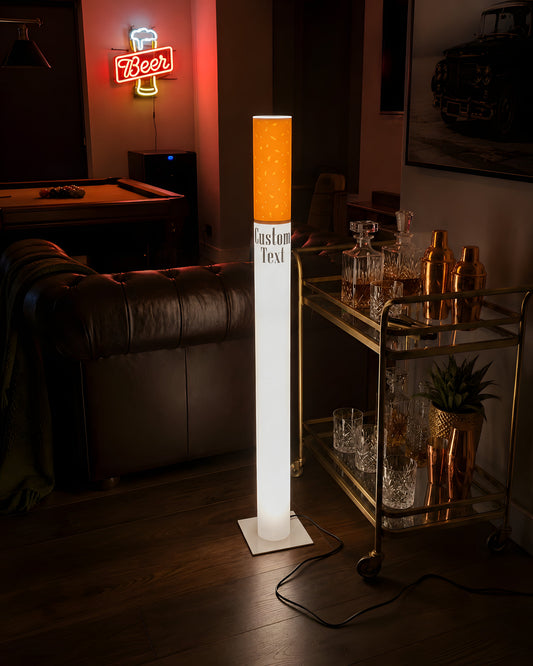 Giant cigarette floor lamp glowing in a man cave game room beside a bar cart