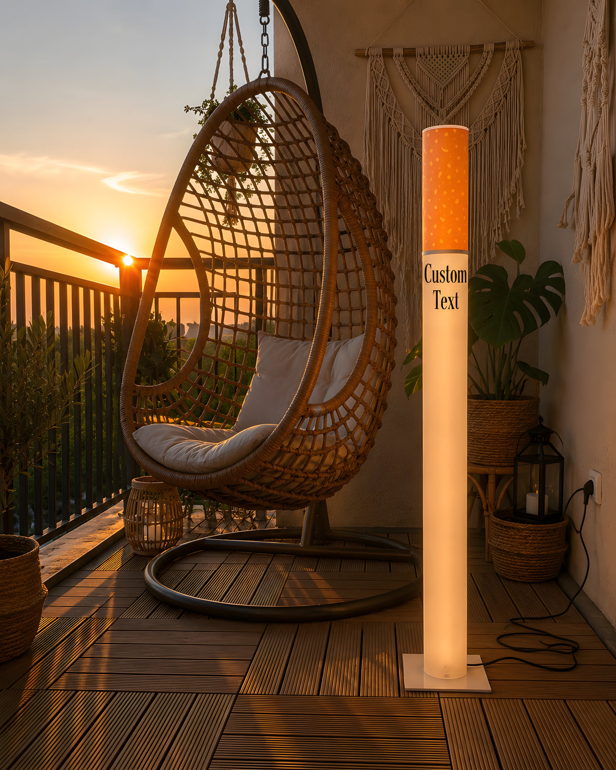Marlboro Lamp giant cigarette floor lamp 95 cm lit on a wooden balcony at sunset next to a rattan hanging egg chair and macrame decor