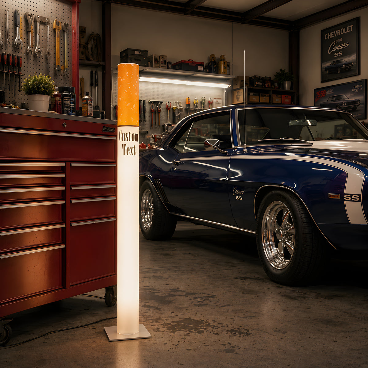 Marlboro Lamp giant cigarette floor lamp in a man cave garage next to a blue classic muscle car and a red rolling tool chest
