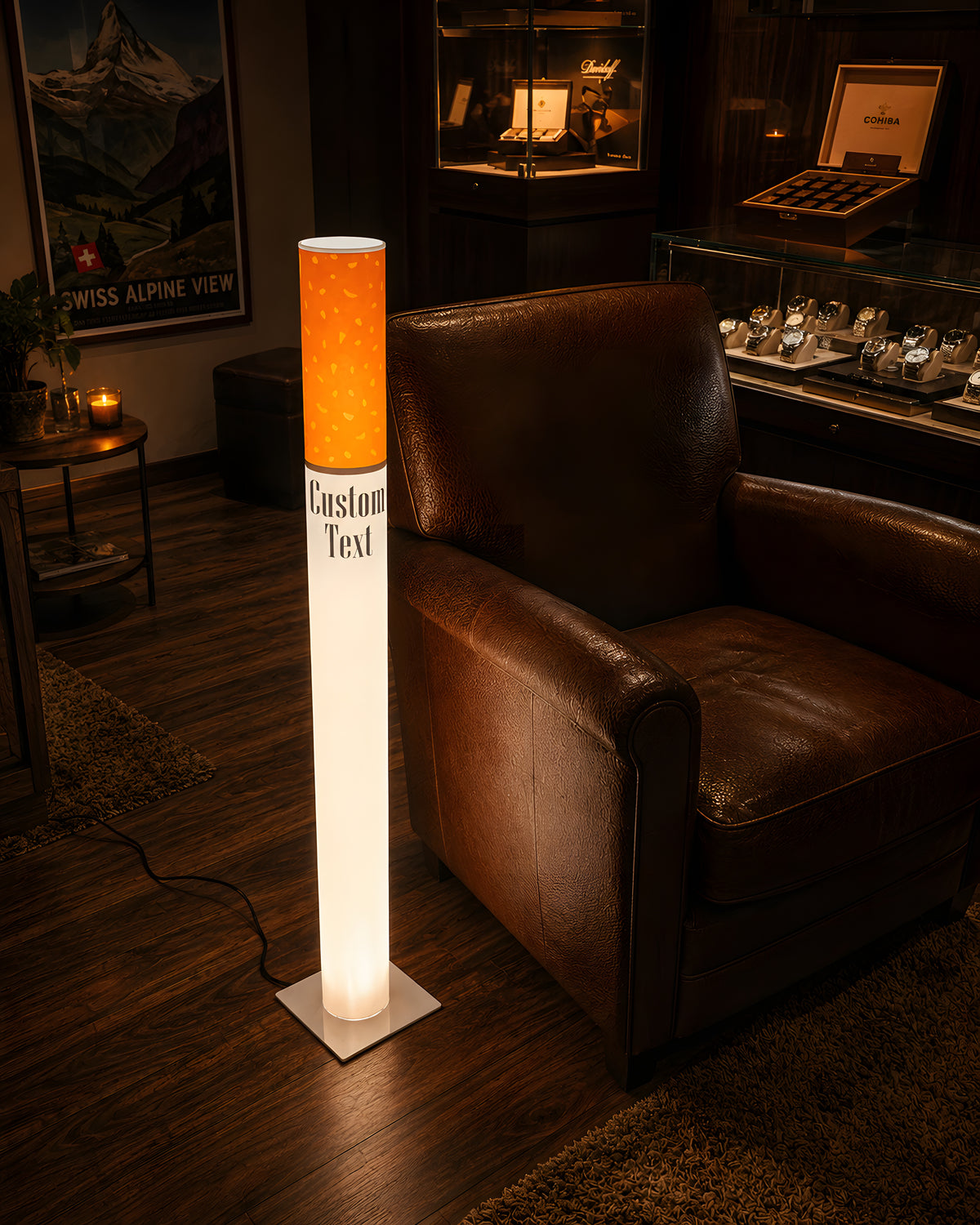 Marlboro Lamp vintage giant cigarette lamp glowing beside a brown leather club armchair in a dark wood den with a whiskey display cabinet